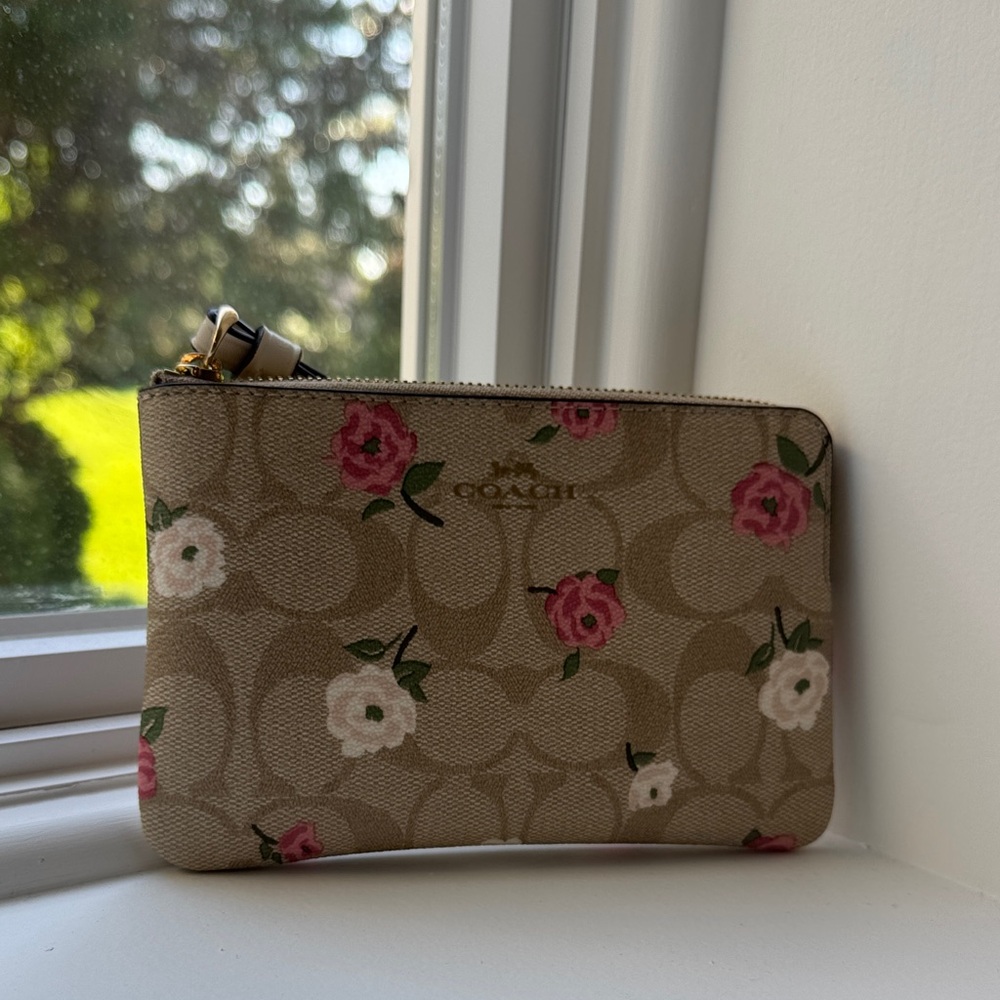 Coach Tan Wristlet with Pink and White Floral Design